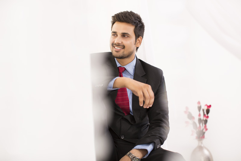 businessman in suit smiling and posing 