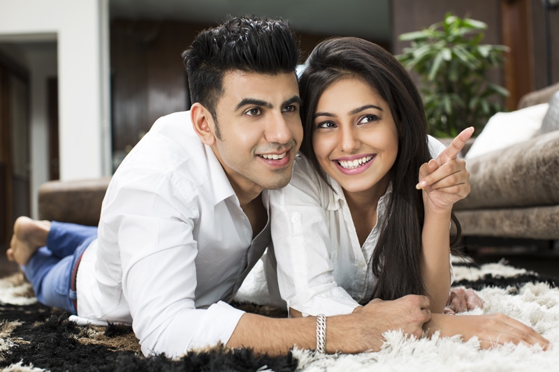 couple smiling and posing at home 