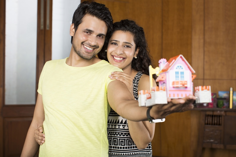 couple posing with home miniature