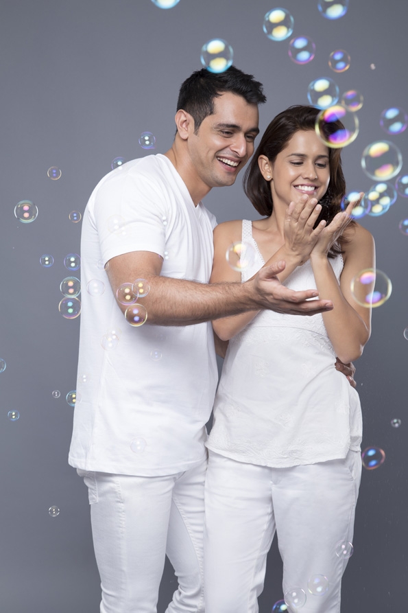 couple playing with water bubbles 