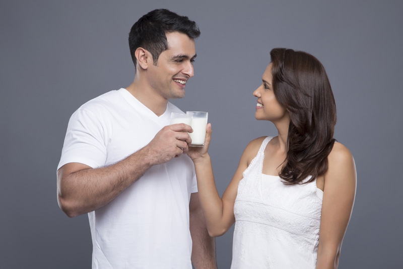 couple posing with milk glasses
