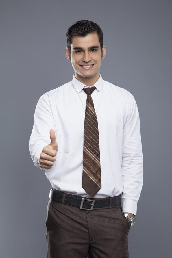 man in formals doing thumbs up