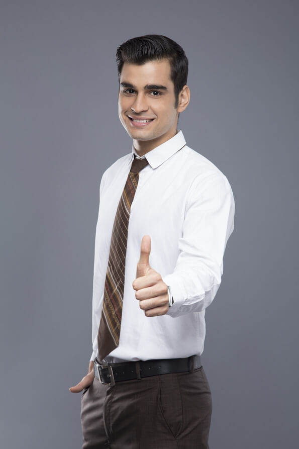 professionally dressed man doing thumbs up