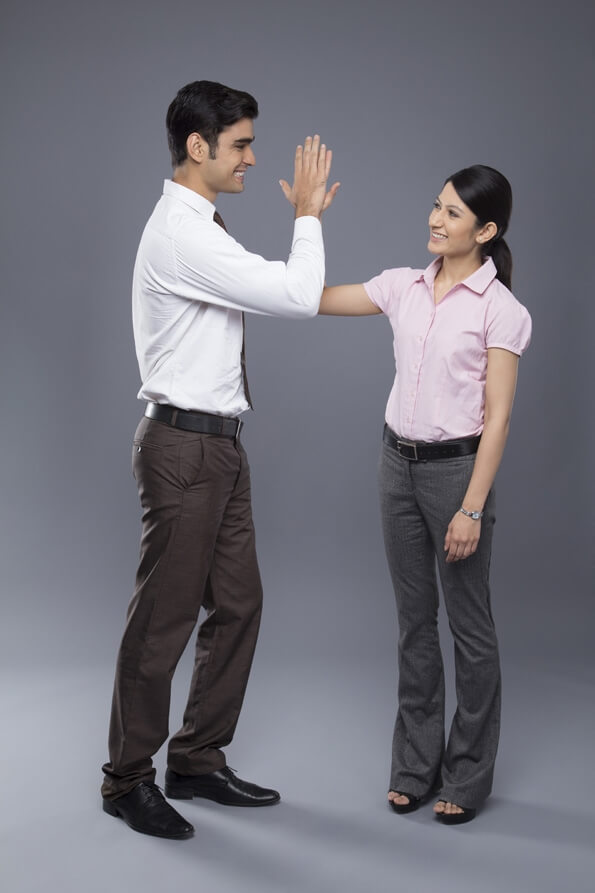 smart young business couple doing high-five