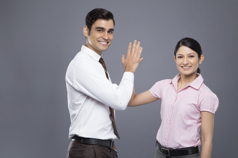 smart young business couple doing high-five