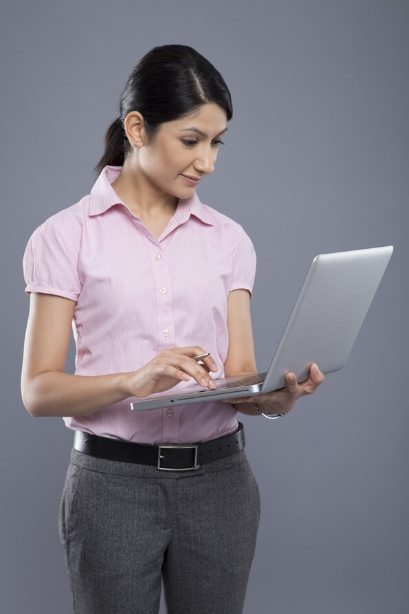 attractive female executive using laptop