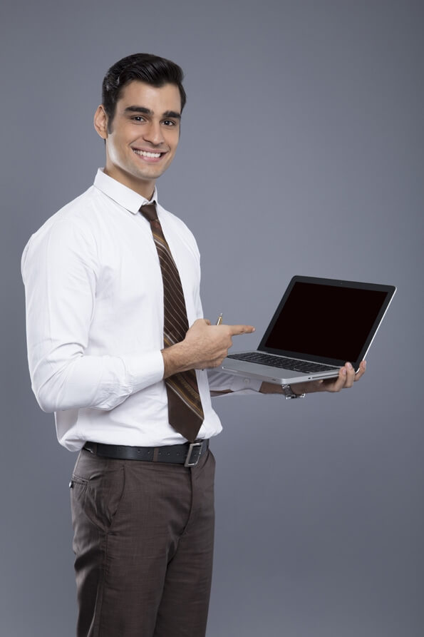 professionally dressed man with a laptop 