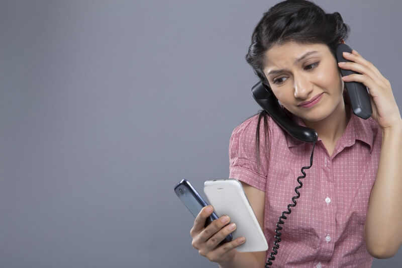 busy woman working and answering a lot of calls at the same time