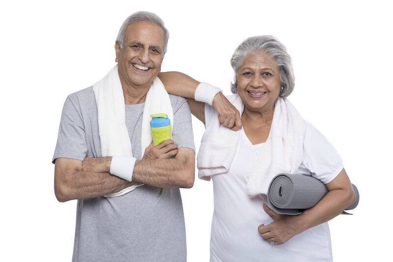 old couple posing in gym wear