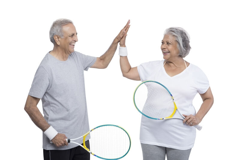 old couple playing tennis 