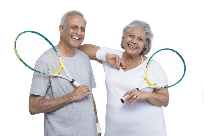 old couple playing tennis 