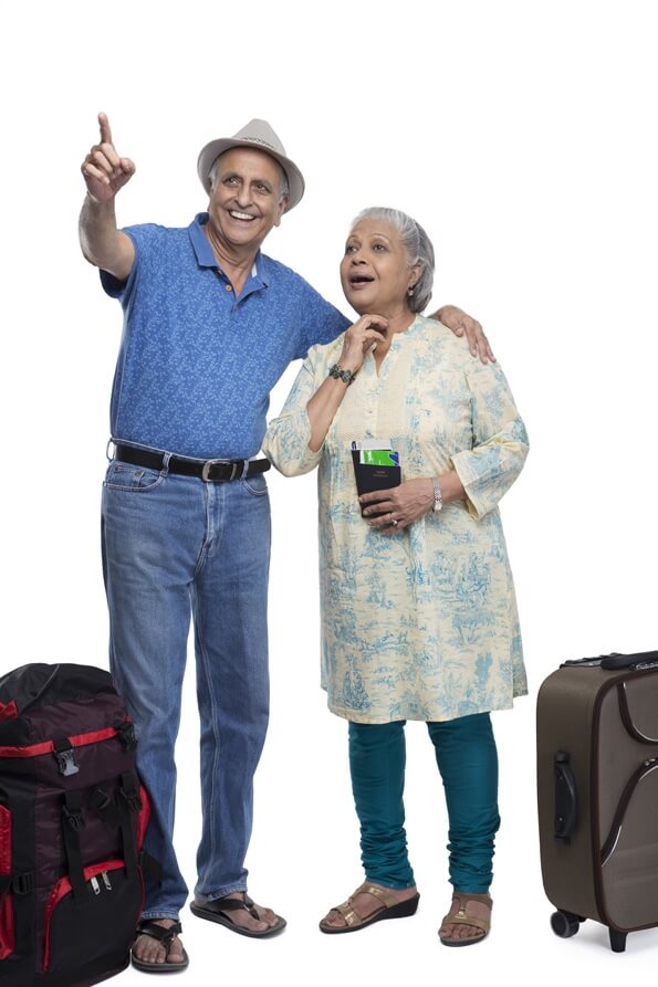 old couple travelling with luggage 