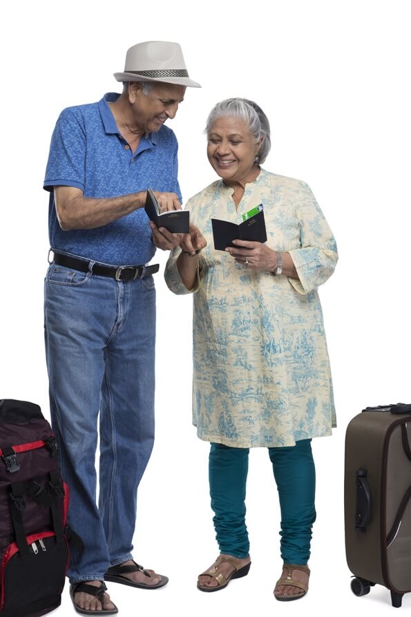 old couple checking their passports 