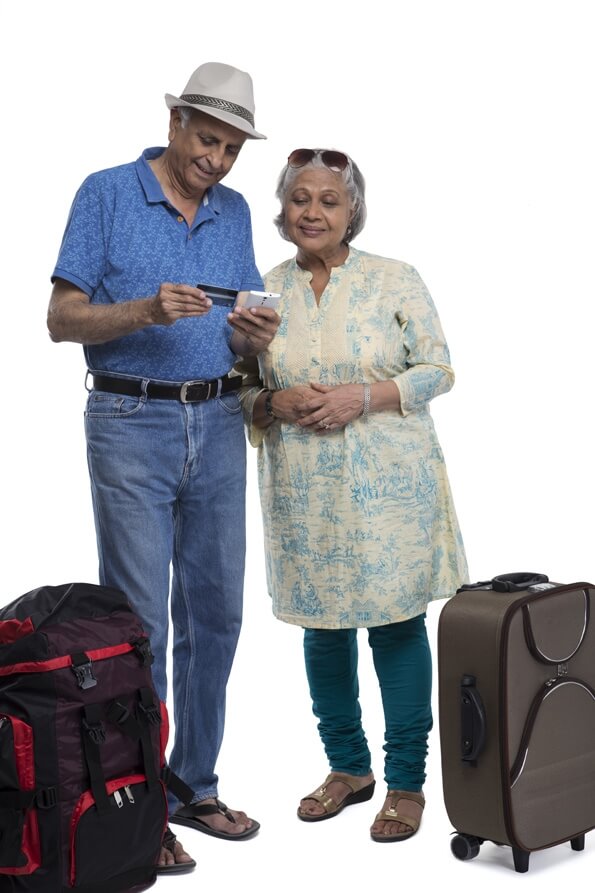 old couple with travelling bags 
