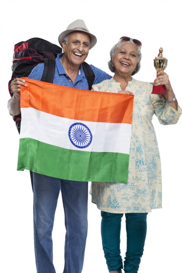 old couple with indian flag and trophy