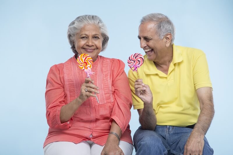old couple eating candy 