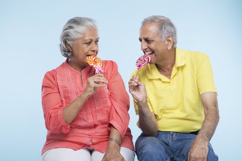 old couple eating candy 