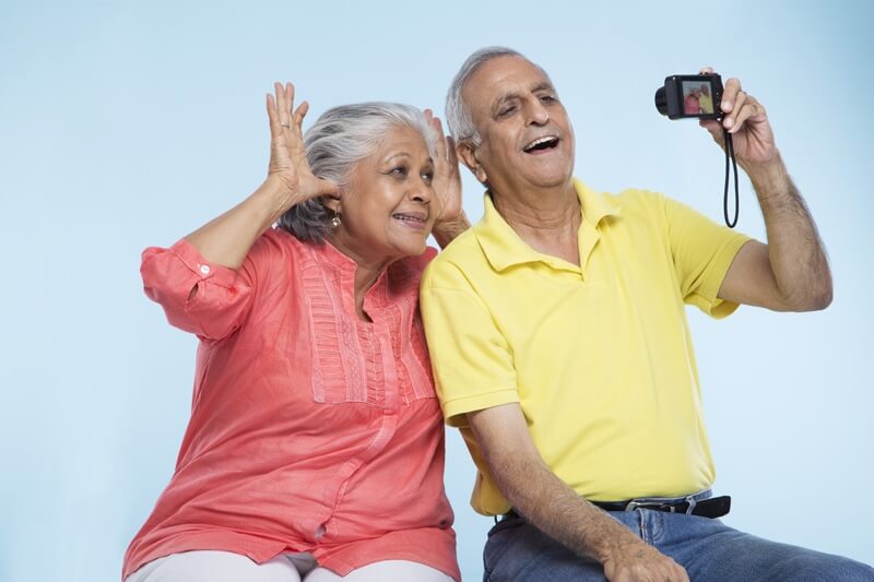 old couple posing for photographs 