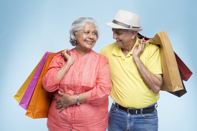 old couple with shopping bags