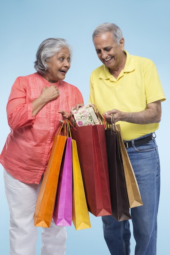 old couple with shopping bags 