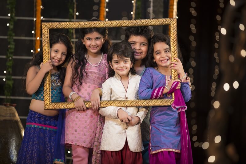 cheerful small group of kids holding a picture frame