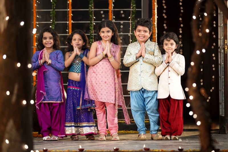 kids holding hands and welcoming on diwali