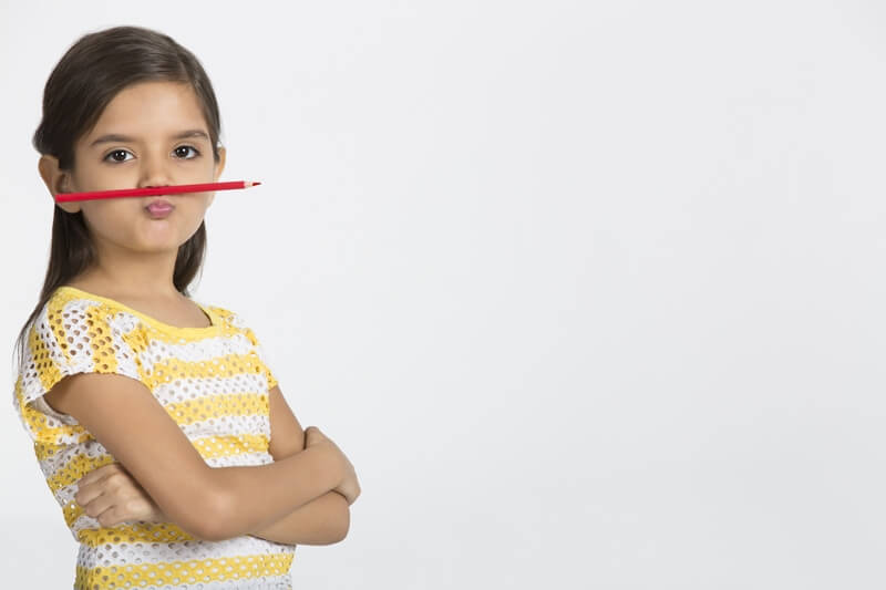 young girl with pencil 
