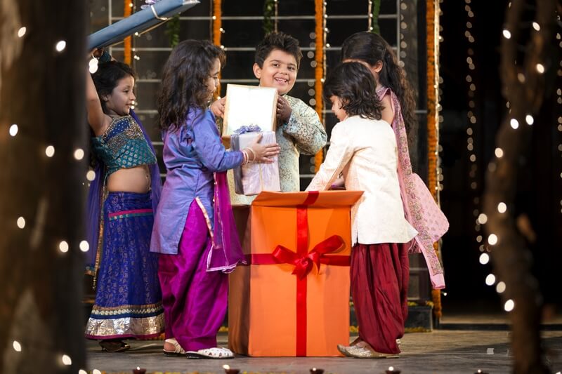 kids offering gift on diwali  