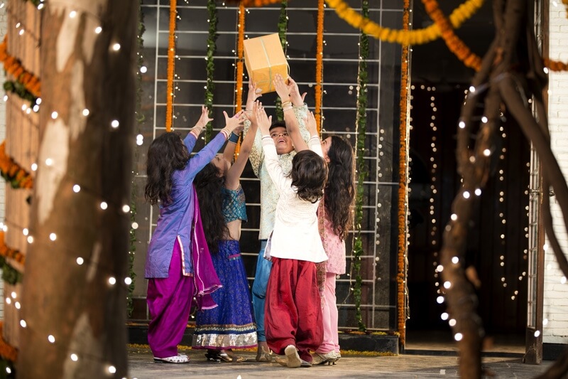 kids offering gift on diwali  