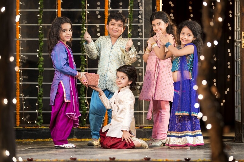 kids giving gift on diwali 
