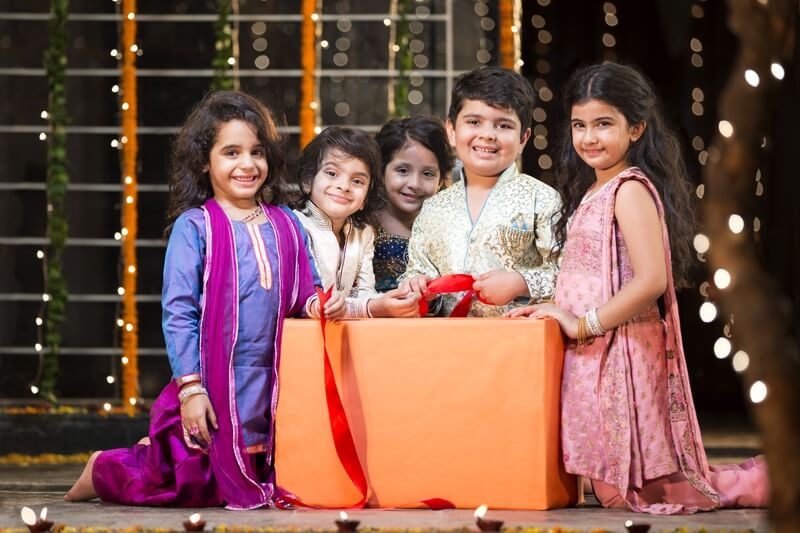 kids offering gift on diwali 
