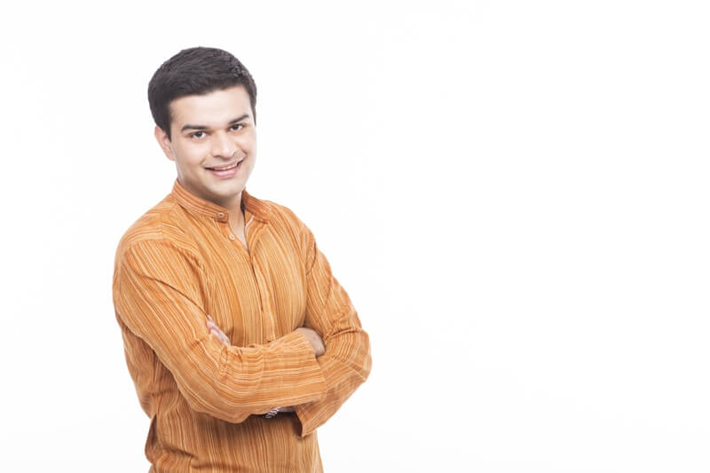 indian man in kurta posing and smiling