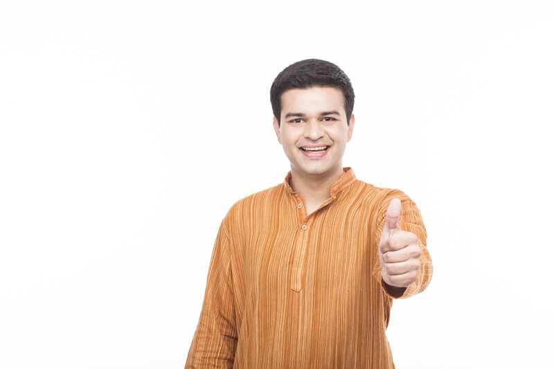indian man in kurta showing thumbs up