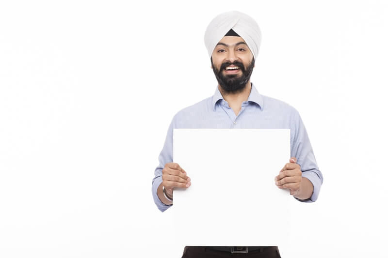 sikh man with a message board