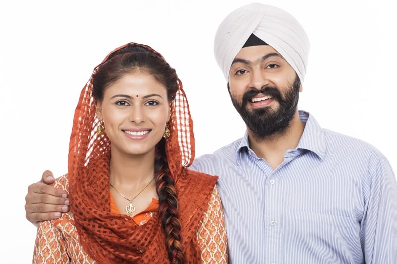 sikh couple smiling and posing 
