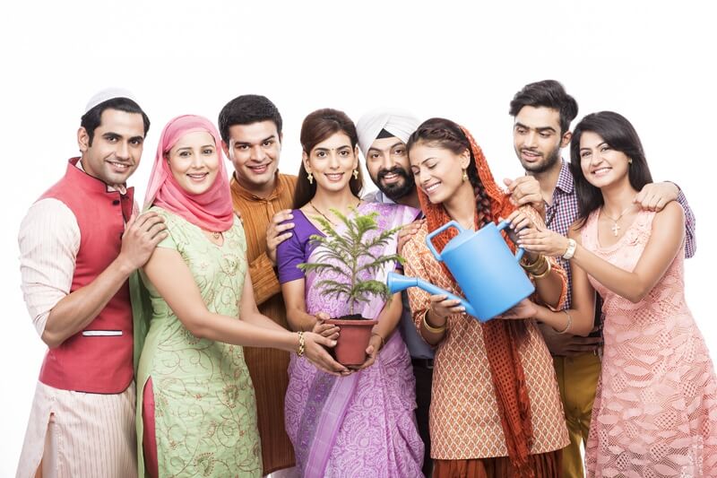 people from all religions giving water to a plant