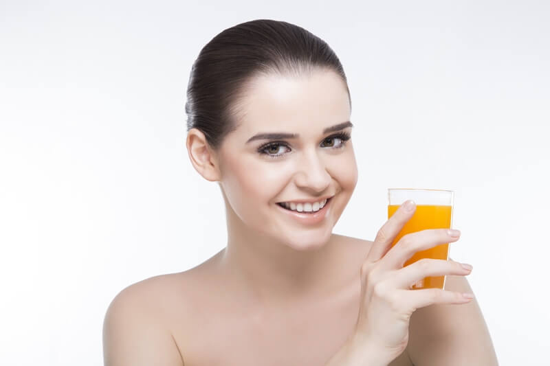 beautiful girl with a glass of orange juice 