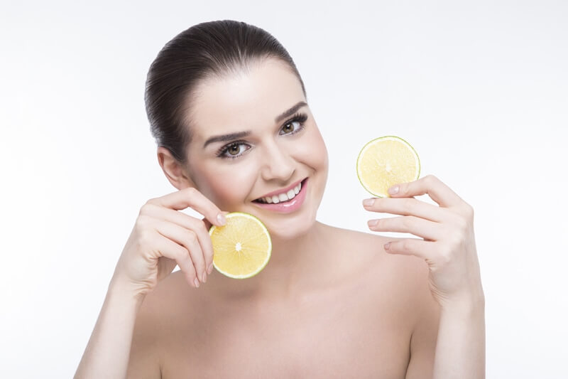 girl posing with lemon slices 