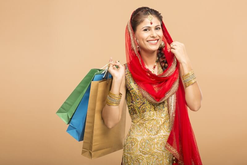 woman posing with shopping bags 