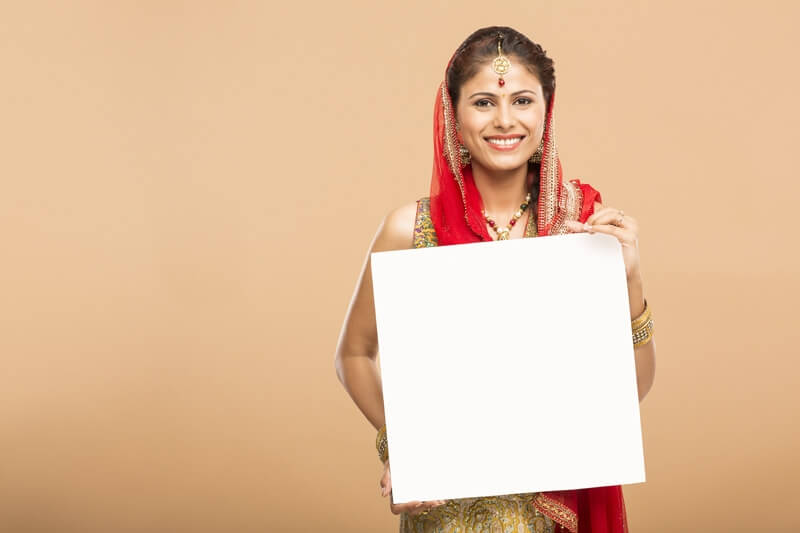 woman posing with message board