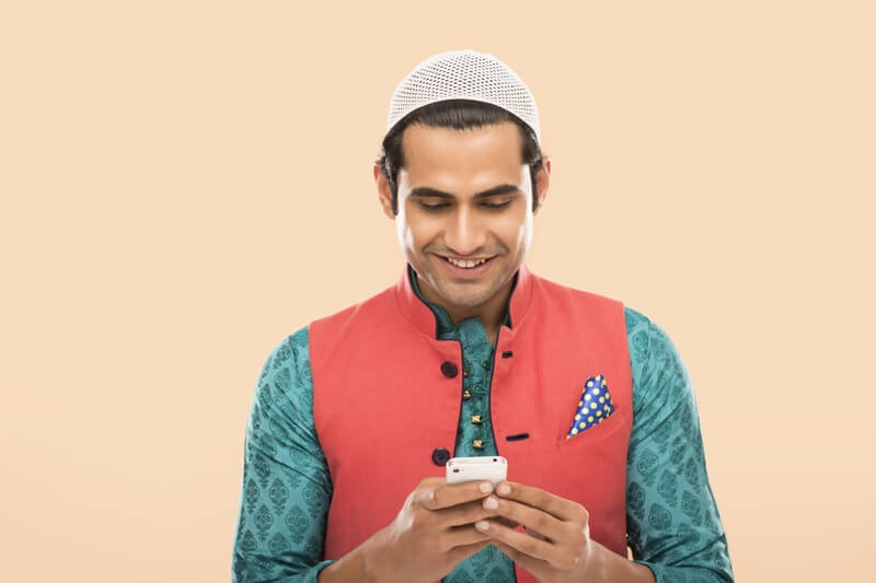 muslim man using mobile phone 