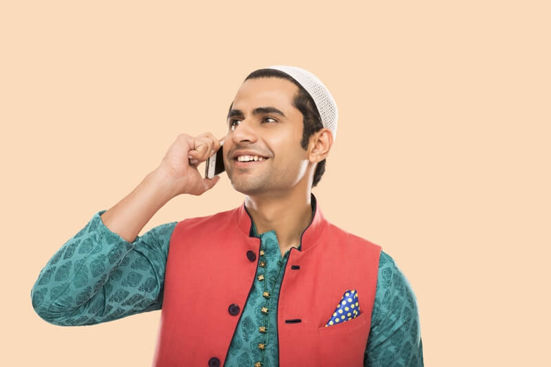muslim man talking on phone 