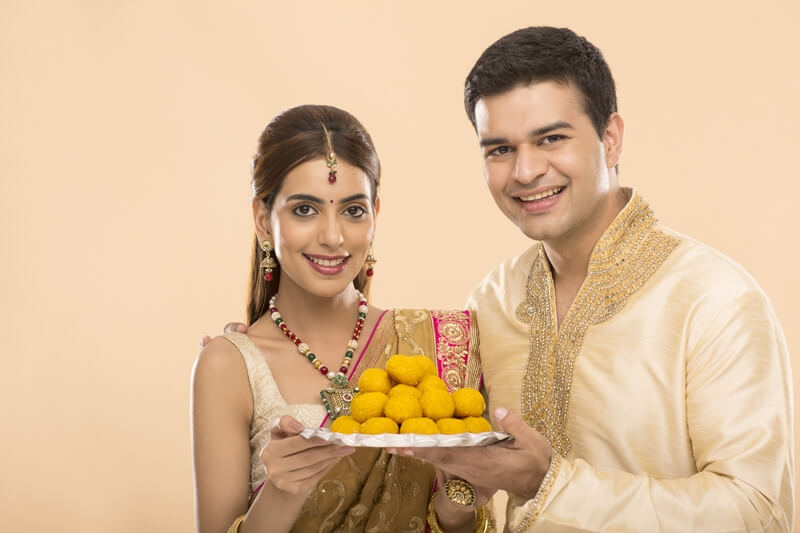 hindu couple with sweets