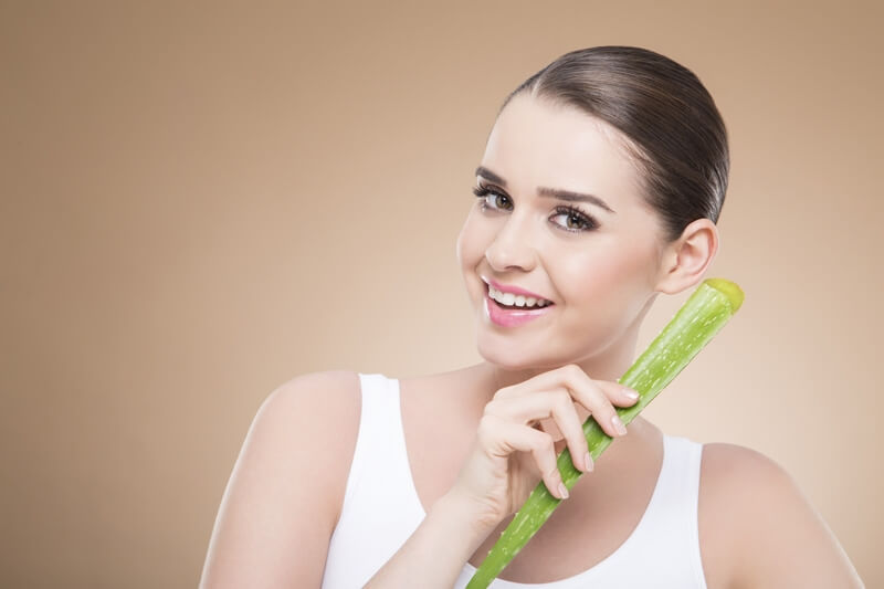girl smiling and posing with aloe vera 