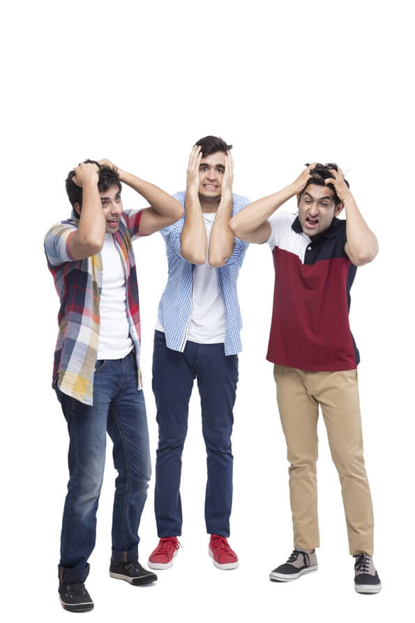 three boys grabbing their head
