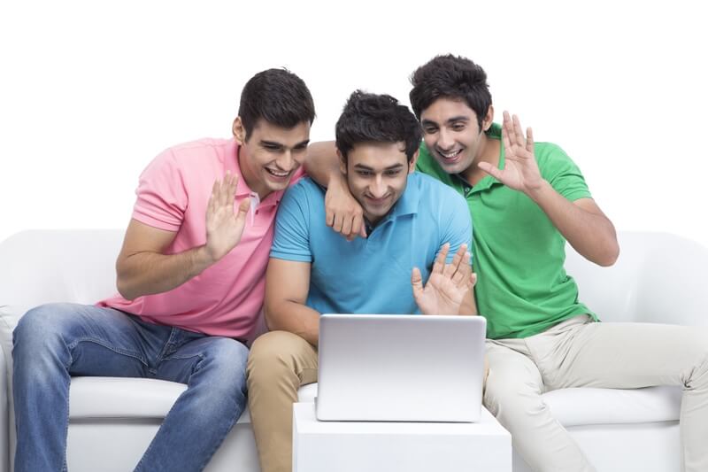 three friends looking at the laptop