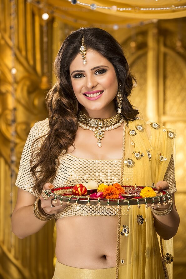 woman in traditional wear with pooja thali
