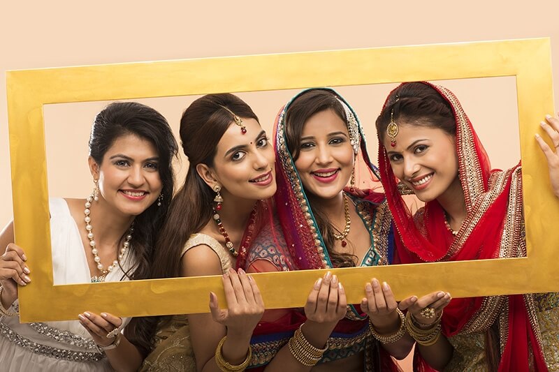 indian women posing with frame