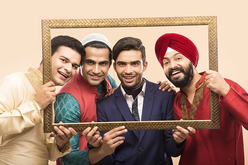 indian men posing with frame