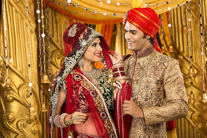indian bride and groom posing 